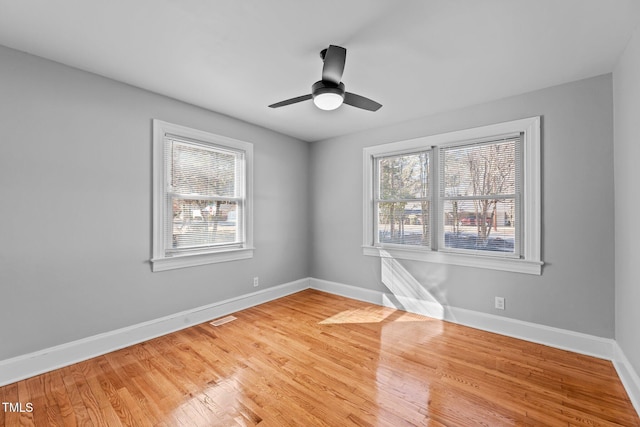 unfurnished room featuring ceiling fan and wood-type flooring