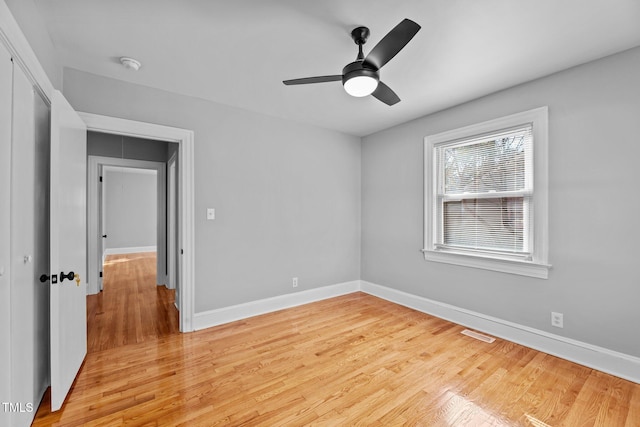 unfurnished bedroom featuring ceiling fan, a closet, and light hardwood / wood-style flooring