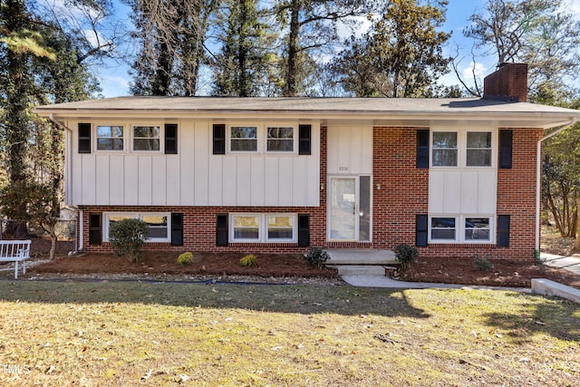 bi-level home with a front yard