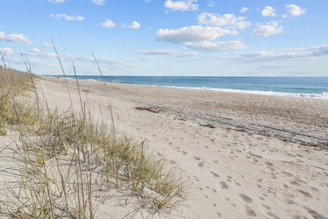 view of water feature with a beach view