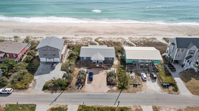 bird's eye view featuring a water view and a view of the beach