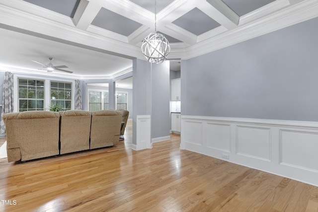 living room with ornamental molding, beamed ceiling, coffered ceiling, and light wood-style floors