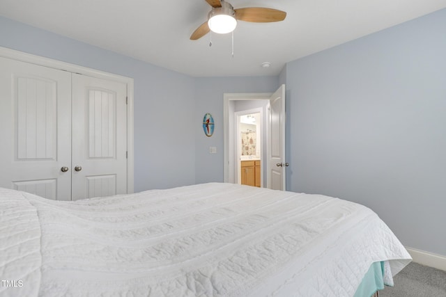 carpeted bedroom with a ceiling fan, a closet, and baseboards