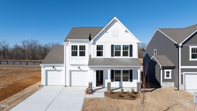 view of front of home with a garage and a porch