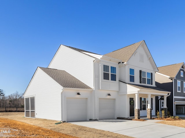 view of front of property with a porch and a garage