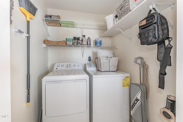 laundry area with separate washer and dryer