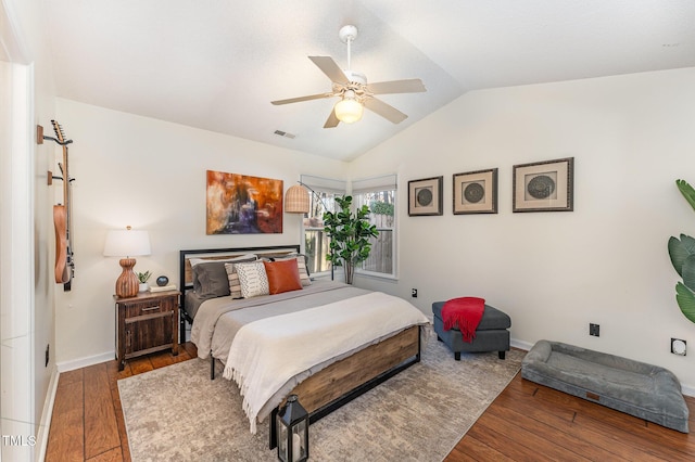 bedroom with wood-type flooring, vaulted ceiling, and ceiling fan