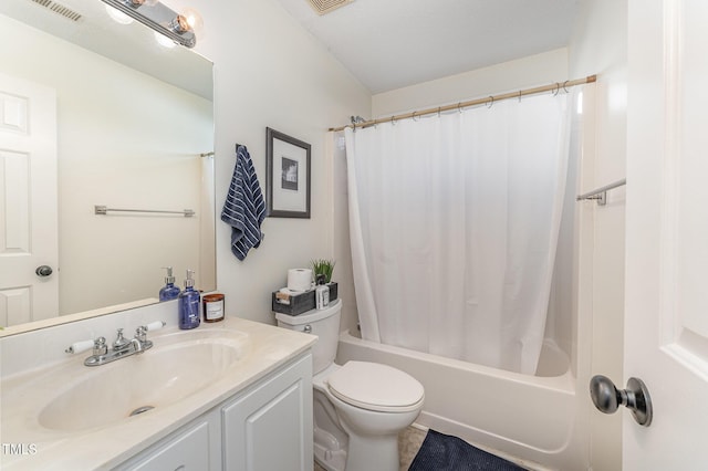 full bathroom featuring vanity, shower / bath combination with curtain, toilet, and a textured ceiling