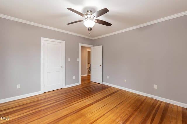 spare room with hardwood / wood-style floors, ceiling fan, and ornamental molding