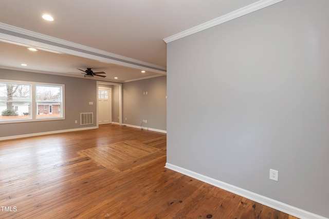 spare room with hardwood / wood-style floors, ceiling fan, and crown molding