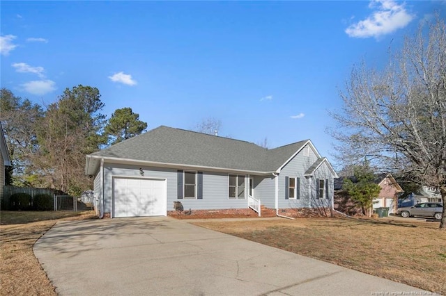 single story home featuring a front lawn and a garage