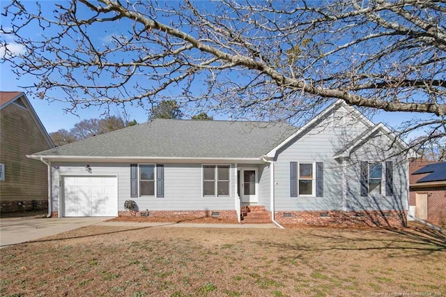 ranch-style home featuring a garage and a front lawn