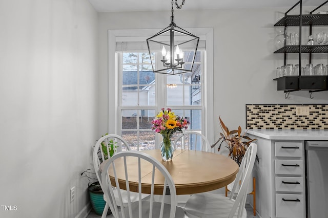 dining room featuring a dry bar and an inviting chandelier