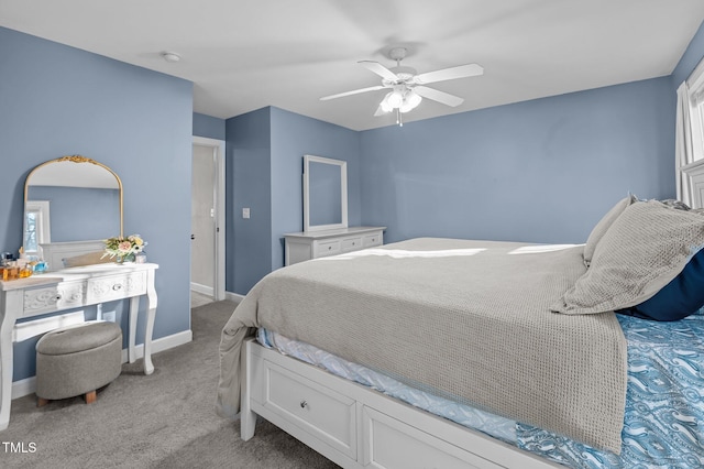 bedroom featuring a ceiling fan, light carpet, and baseboards