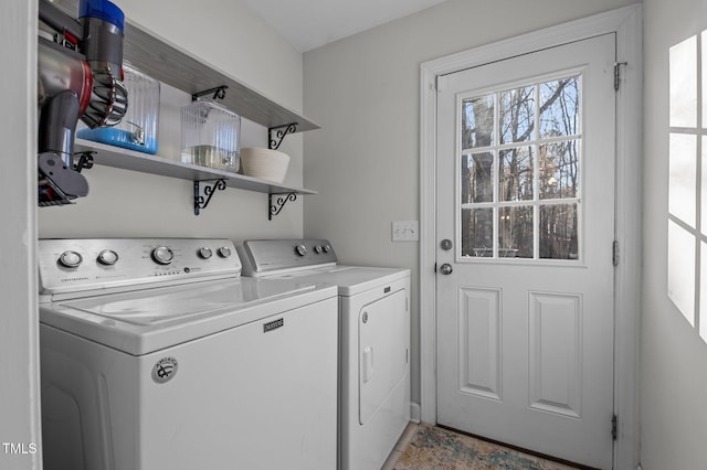 washroom featuring laundry area and separate washer and dryer