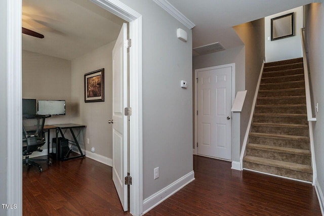 stairs featuring ceiling fan, ornamental molding, and wood-type flooring