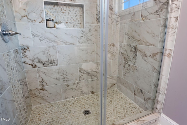 bathroom featuring an enclosed shower