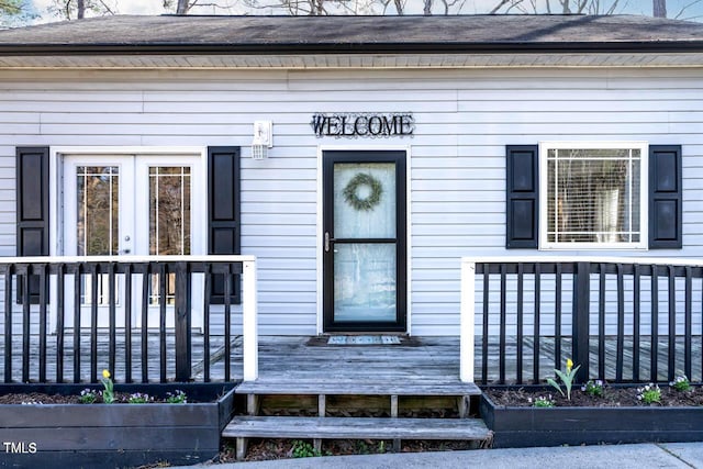 doorway to property featuring a porch