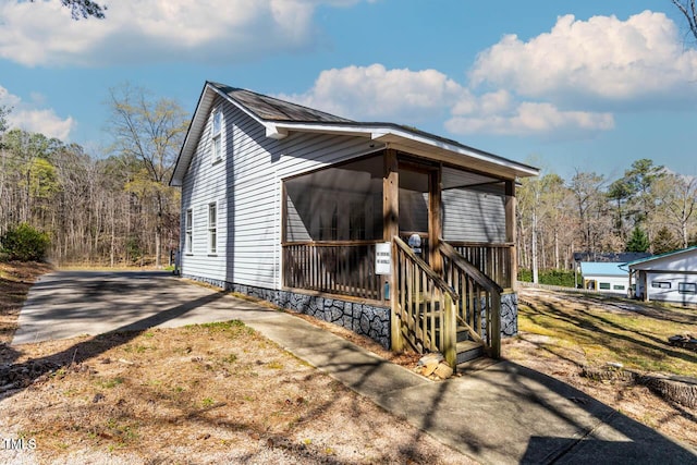 exterior space with a sunroom