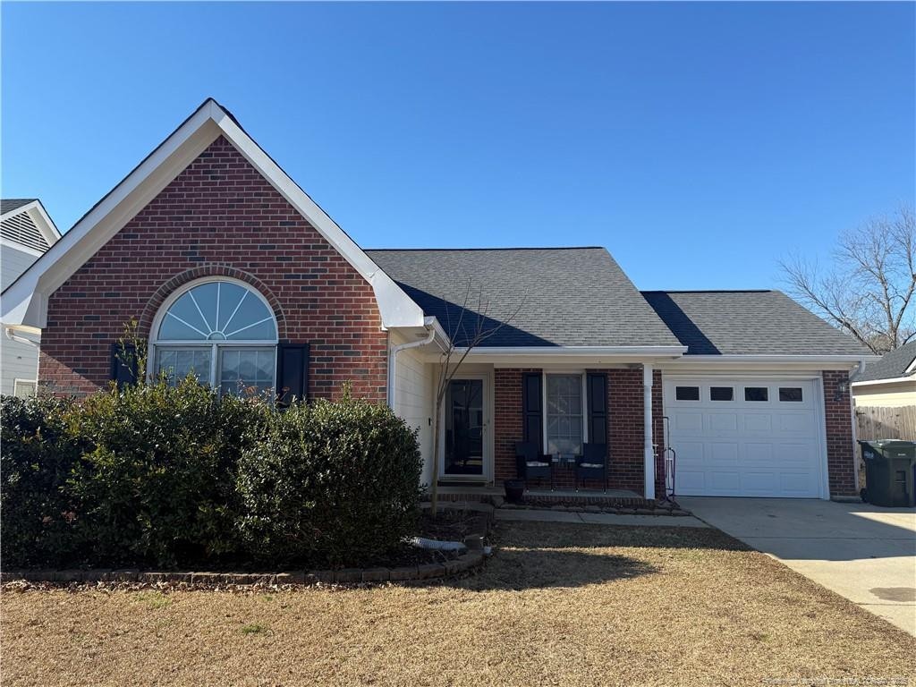 view of front of home with a porch and a garage