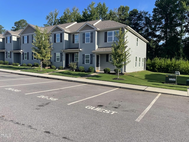 view of front of property with a front lawn