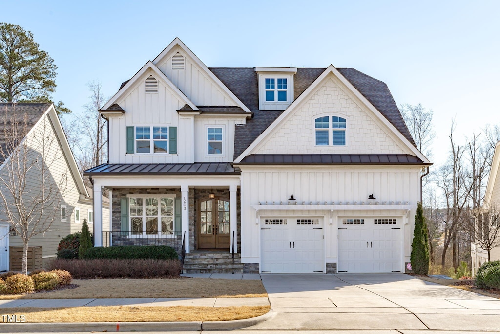 view of front facade with a porch and a garage