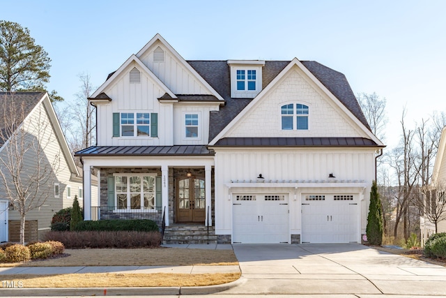 view of front facade with a porch and a garage