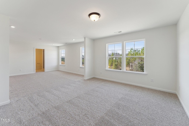 empty room with light colored carpet