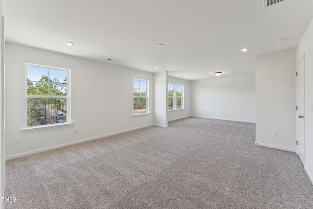 spare room with light colored carpet