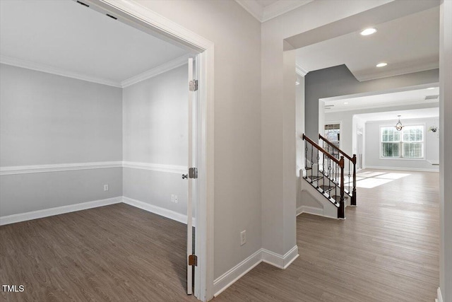 hallway with ornamental molding and dark hardwood / wood-style flooring