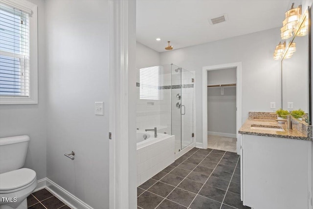 full bathroom featuring vanity, toilet, independent shower and bath, and tile patterned flooring