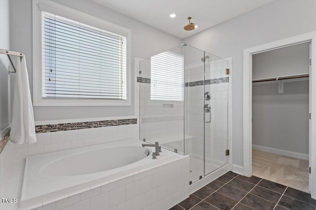 bathroom featuring plus walk in shower and tile patterned flooring