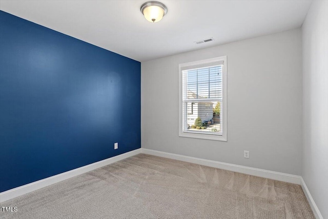 empty room featuring carpet floors