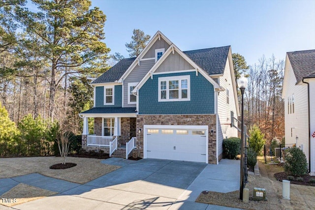 view of front of property featuring a garage and covered porch