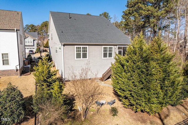 rear view of property with central air condition unit