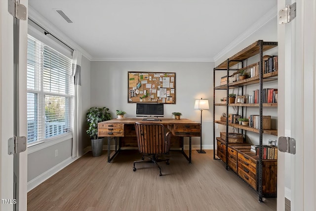 office area featuring crown molding and light hardwood / wood-style floors