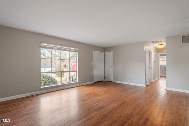 unfurnished room featuring light hardwood / wood-style floors