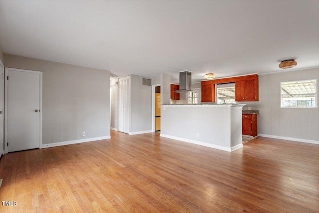 unfurnished living room with light hardwood / wood-style floors