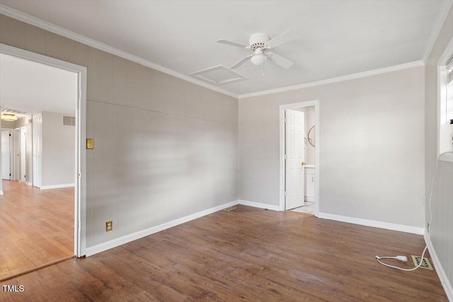 unfurnished room featuring hardwood / wood-style floors and crown molding