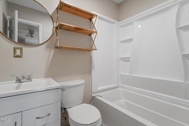 full bathroom featuring shower / bathtub combination, vanity, and toilet