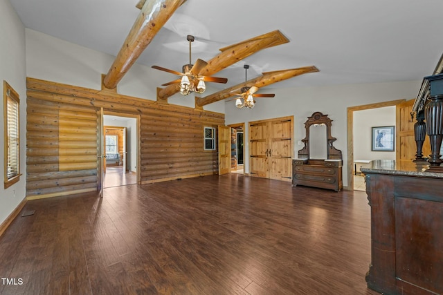 living room featuring ceiling fan, high vaulted ceiling, dark hardwood / wood-style floors, beam ceiling, and rustic walls