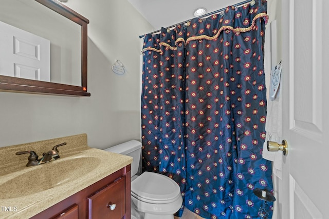 bathroom with toilet, vanity, and a shower with curtain