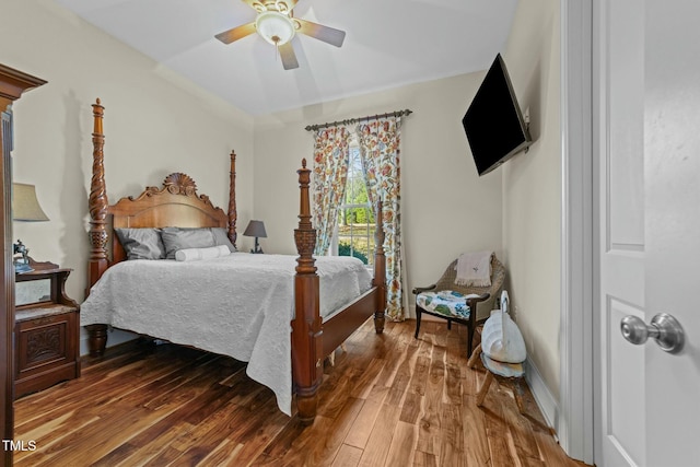 bedroom with ceiling fan and hardwood / wood-style flooring