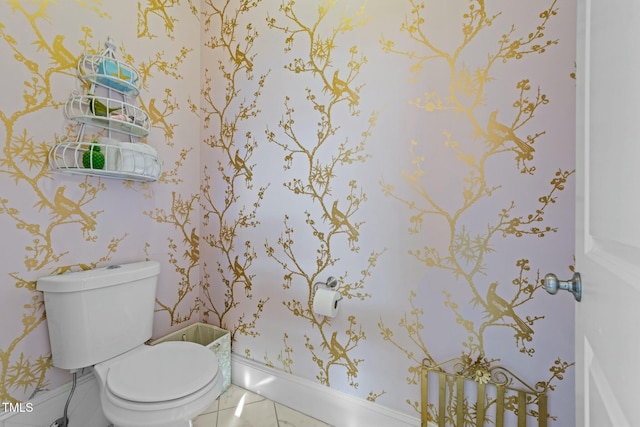 bathroom with tile patterned flooring and toilet