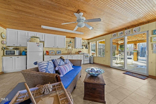 tiled living room with ceiling fan and wooden ceiling