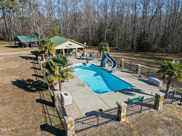 view of pool featuring a water slide, a patio area, and a gazebo