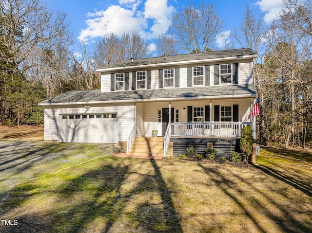 view of front facade with a front lawn, a porch, and a garage