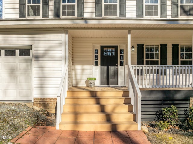 entrance to property featuring a porch