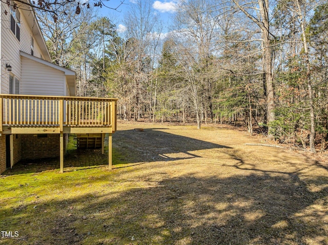 view of yard with a wooden deck