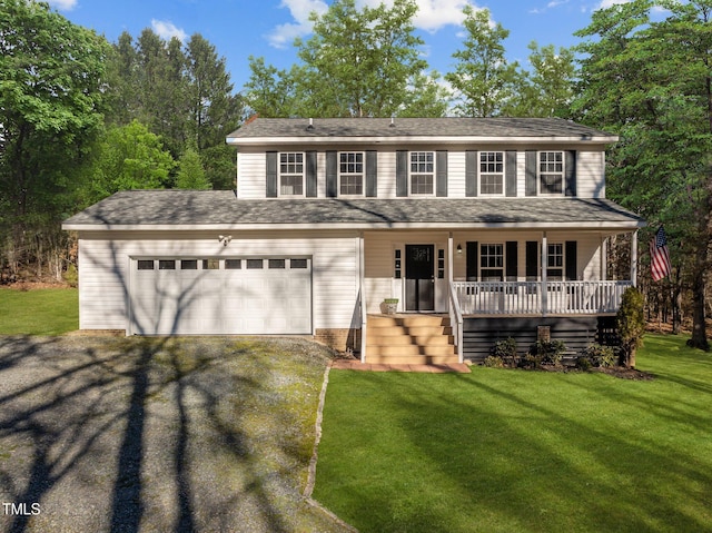 colonial house featuring a front yard, covered porch, and a garage